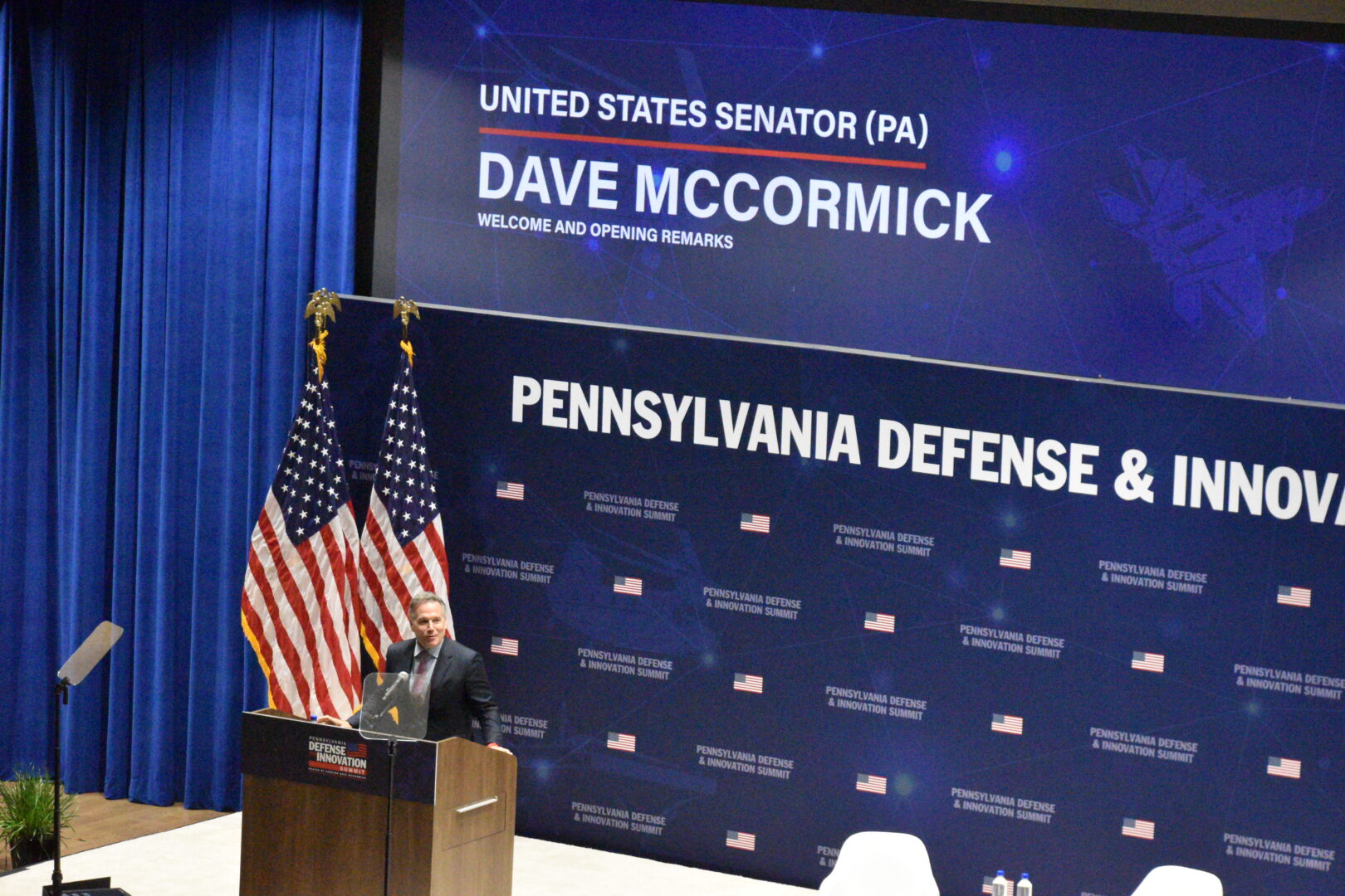 U.S. Sen. Dave McCormick offers opening remarks on stage for his Pennsylvania Defense and Innovation Summit at the Army War College in Carlisle on July 14, 2026. 