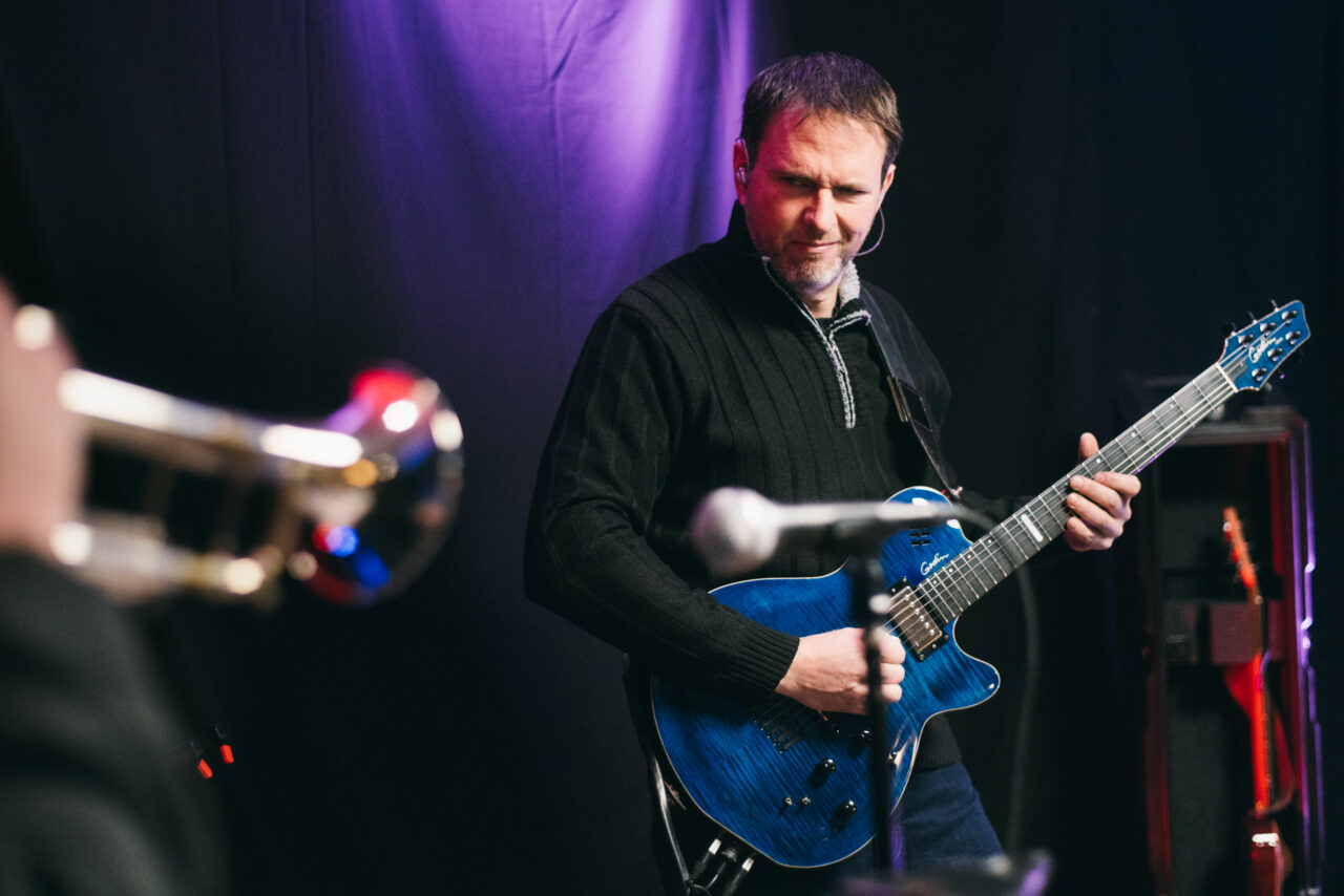 A man playing guitar