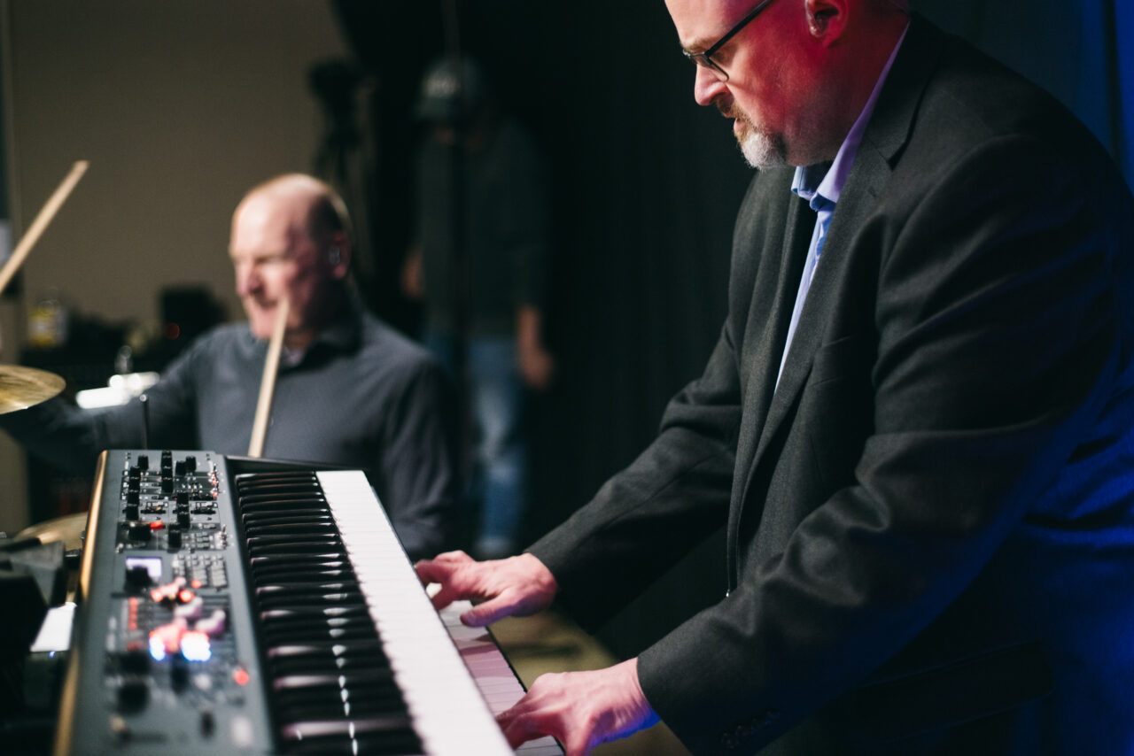 A man playing an electronic keyboard.